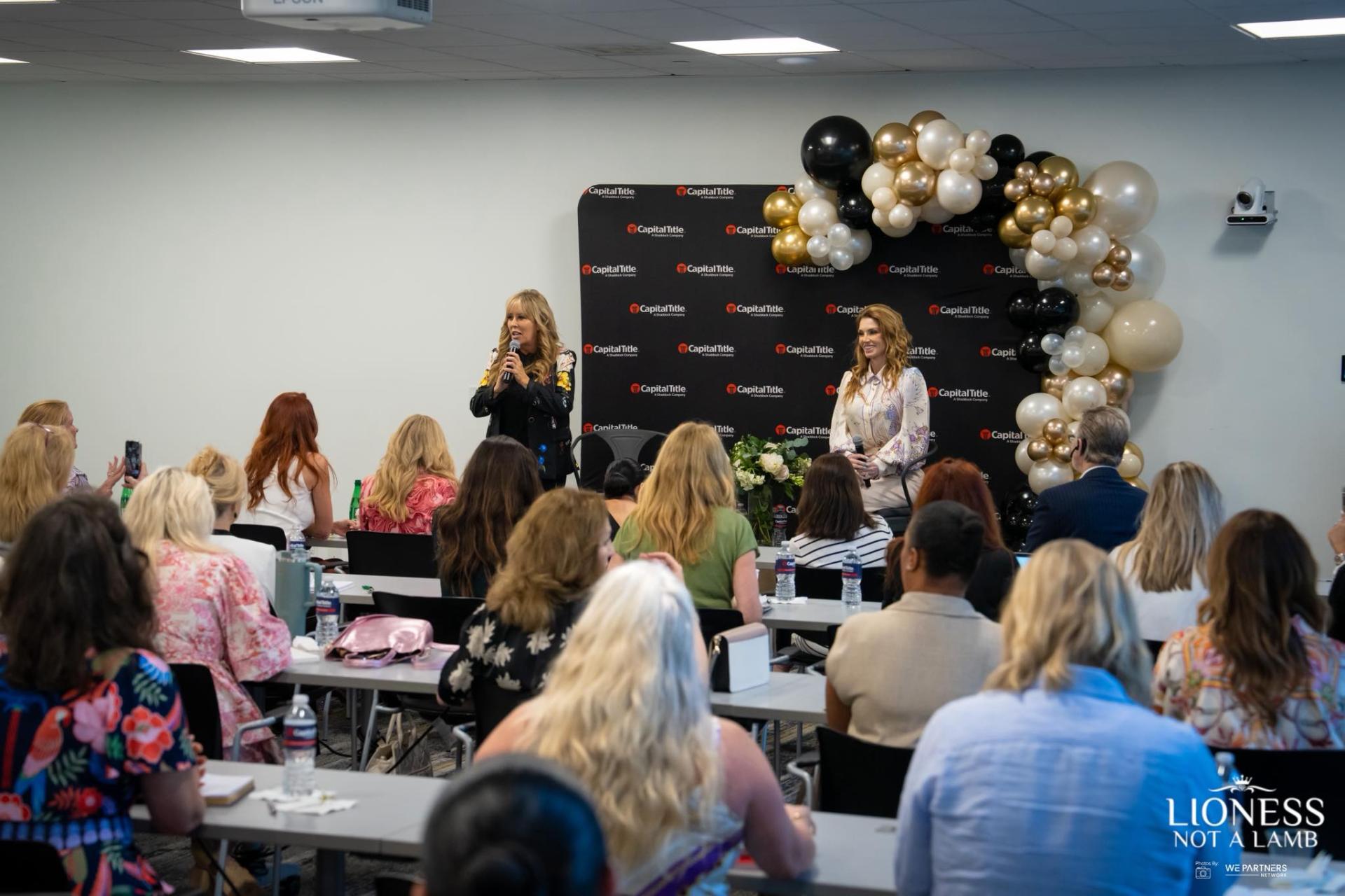 Lisa Copeland speaking to a room of women at a Lioness event